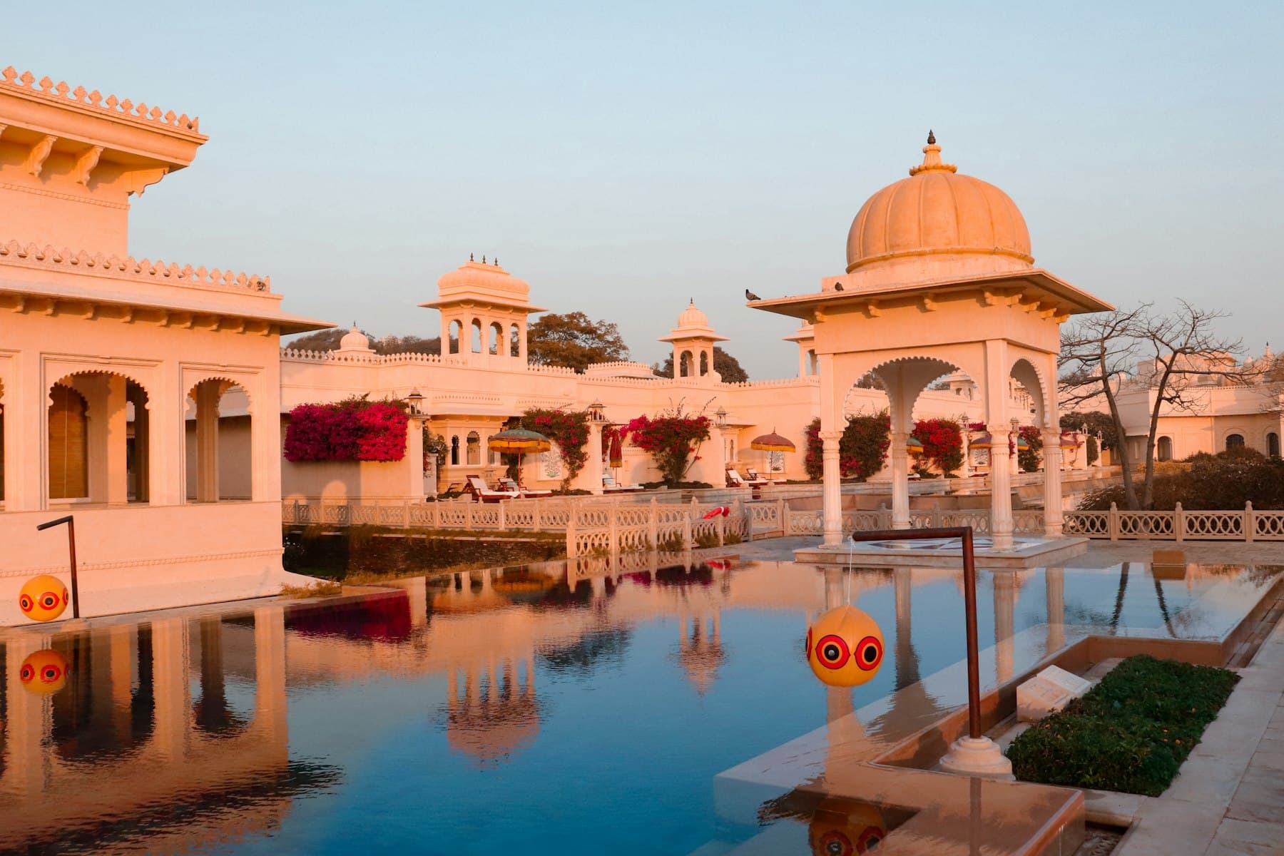 Reflecting pool between white domed pavilions