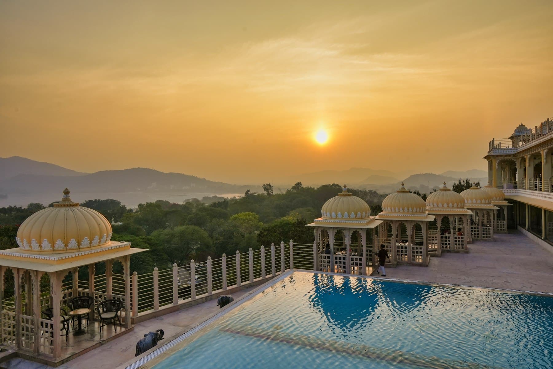 Rooftop terrace with domed pavilions at sunset